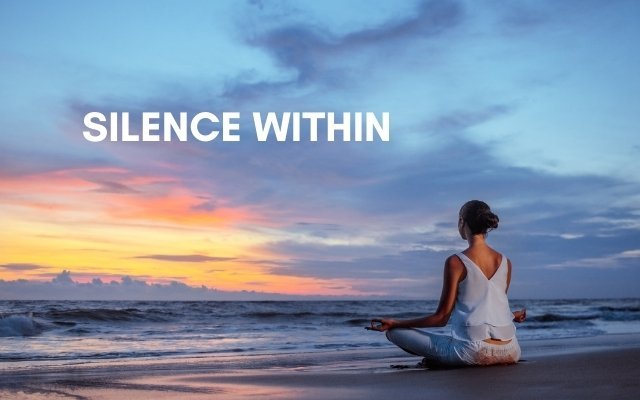 a woman meditating near a beach