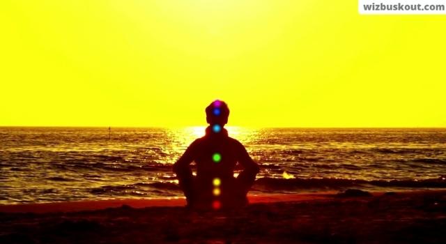 a person meditating near a beach